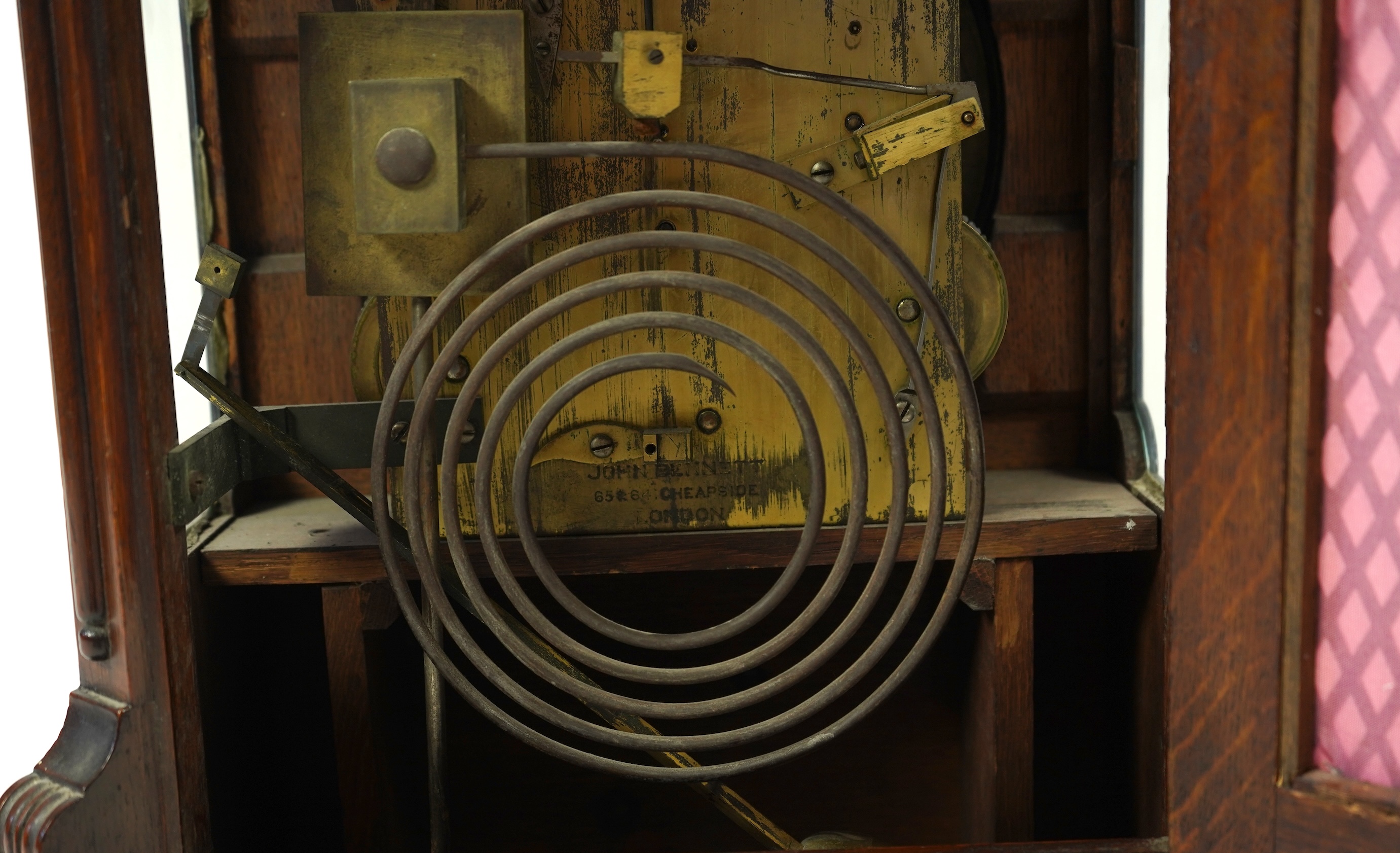 A late 19th century carved oak triple fusee bracket clock